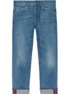 GUCCI TAPERED DENIM trousers WITH WEB,430368XR19112562753