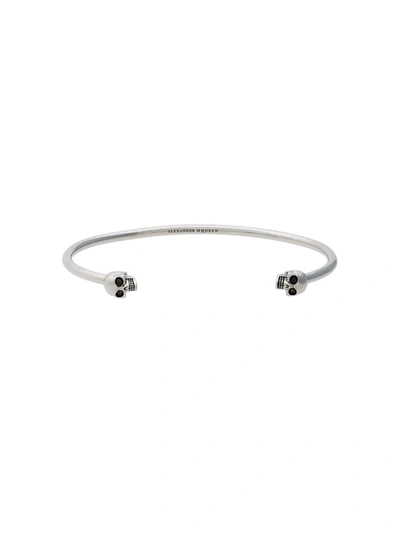 Alexander Mcqueen Double Skull Bangle In Metallic