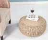 Ashley Spruce Solid Braided Pouf In Brown