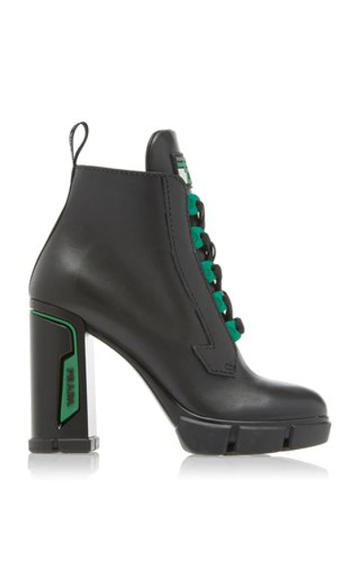 Prada Tronchetti Leather Ankle Boots In Black