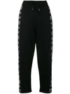 MCQ BY ALEXANDER MCQUEEN CROPPED REPEAT LOGO TRACK PANTS