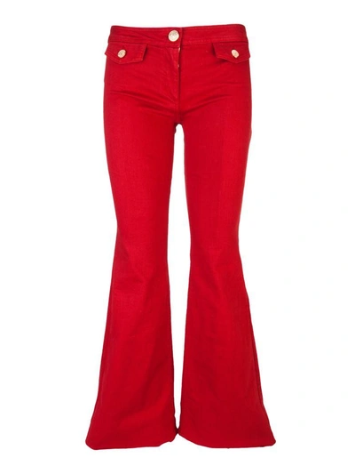 Balmain Denim Stretch Flare Trousers In Red