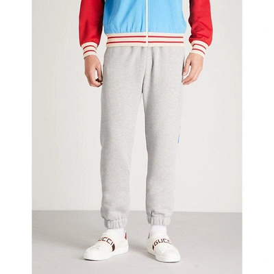 Gucci Tapered Logo-print Loopback Cotton-jersey Sweatpants In Grey