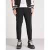 ALEXANDER MCQUEEN RELAXED-FIT SKINNY CREPE TROUSERS