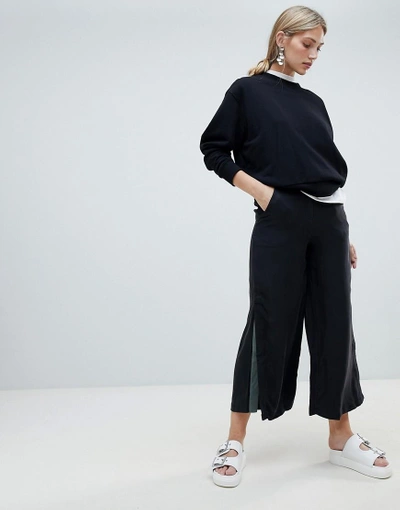 Native Youth Wide Leg Trousers With Contrast Flared Panel - Black