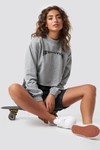 ASTRIDOLSENXNAKD REVOLUTION CROPPED SWEATER - GREY