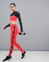 IVY PARK ACTIVE LOGO TAPED SIDE STRIPE LEGGINGS IN RED - RED,29L37QFLR