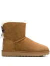 Ugg Mini Bailey Bow Ii Shearling Fur Boots In Brown