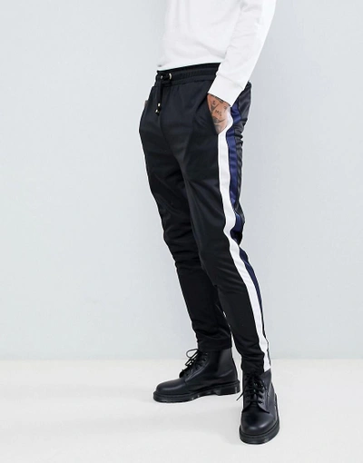 Criminal Damage Skinny Sweatpants In Black With Blue Side Stripe - Black