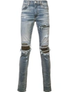 AMIRI DISTRESSED SKINNY JEANS