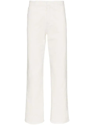 Haider Ackermann Raw Hem Tapered Cotton Denim Jeans In White