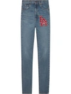 GUCCI SKINNY DENIM TROUSERS WITH LA ANGELS™ PATCH