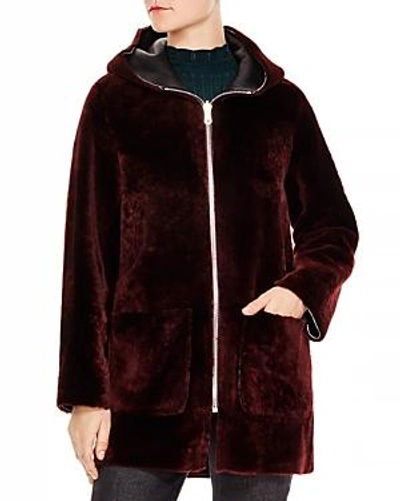 Sandro Reversible Hooded Leather And Shearling Coat In Red