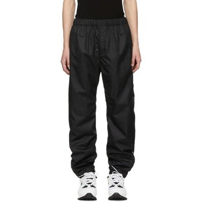 Givenchy Snap Seam Logo Jogger Trousers In Black