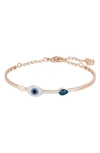 Swarovski Rose Gold-tone Clear And Blue Crystal Evil Eye Adjustable Bangle Bracelet In Blue