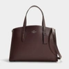 COACH Charlie Carryall in Burgundy Polished Pebble Leather