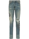 AMIRI SNAKE EMBROIDERED DISTRESSED JEANS