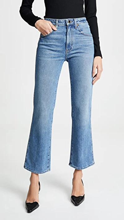 Khaite Vivian Cropped High-rise Bootcut Jeans In Blue
