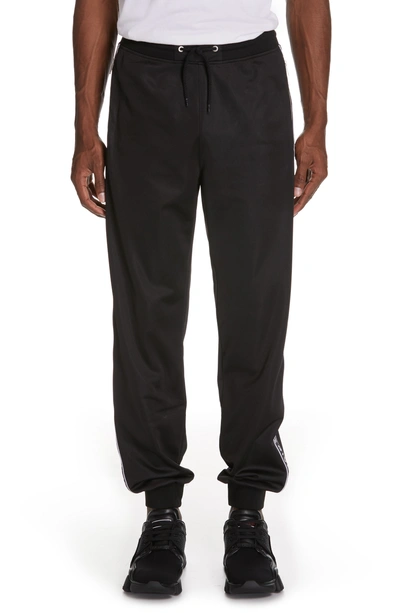 Givenchy Tapered Logo-jacquard Fleece-lined Tech-jersey Sweatpants In Black