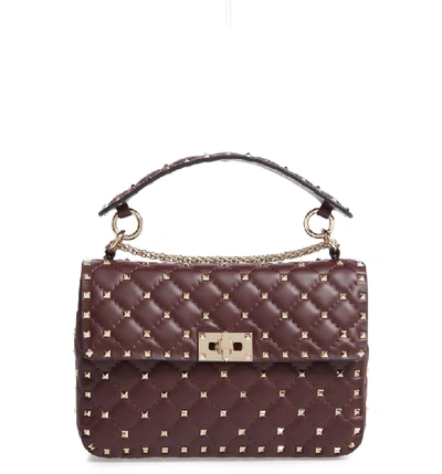Valentino Garavani Medium Rockstud Matelassé Quilted Leather Crossbody Bag In Rubin
