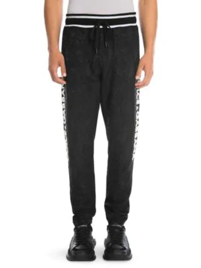 Dolce & Gabbana Banded Tonal Print Sweatpants In Black