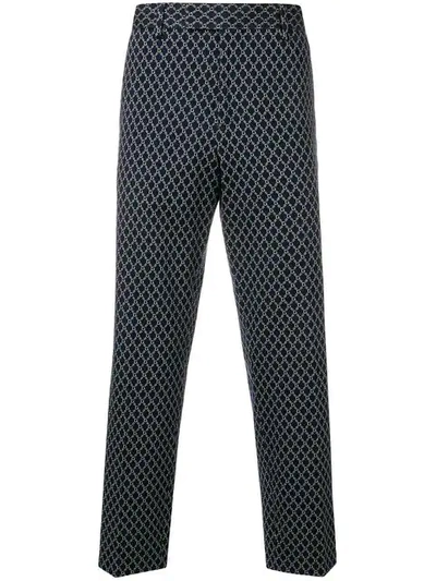 Gucci All-over Logo Print Trousers In Blue