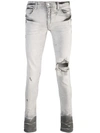 AMIRI DISTRESSED SKINNY JEANS