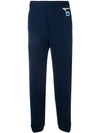 PRADA LOGO PATCH TAPERED TROUSERS