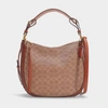 COACH Coated Canvas Signature Sutton Hobo Bag in Brown Canvas