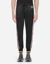 DOLCE & GABBANA SATIN JOGGING PANTS WITH PATCH