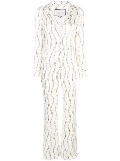 Alexis Danai Printed Long-sleeve Plunging Jumpsuit In Cream Rolo