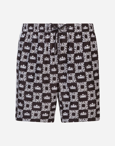 Dolce & Gabbana Mid Swimming Trunks With Crown Print And Pouch Bag In Black