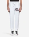 DOLCE & GABBANA COTTON JOGGING PANTS WITH PATCHES