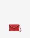Valentino Garavani Medium Rockstud Leather Envelope Pouch In Rouge Pur