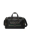 GUCCI GUCCI PRINT LEATHER CARRY-ON DUFFLE