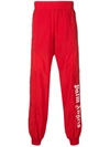 PALM ANGELS LOGO PRINT SIDE STRIPE JOGGERS