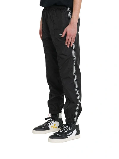 Off-white Slim-fit Webbing-trimmed Shell Track Pants In Black