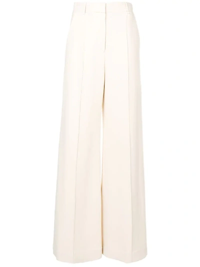 The Row Isla Pintucked Flared Trousers In Neutrals