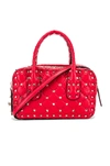 VALENTINO GARAVANI VALENTINO ROCKSTUD SPIKE SMALL DUFFLE BAG IN RED,VENT-WY411