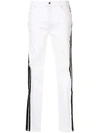 AMIRI AMIRI RIPPED SKINNY JEANS - WHITE