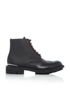 ALEXANDER MCQUEEN TEXTURED LEATHER BROGUE BOOTS,714623