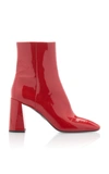 Prada Block Heel Patent Leather Bootie In Black,red