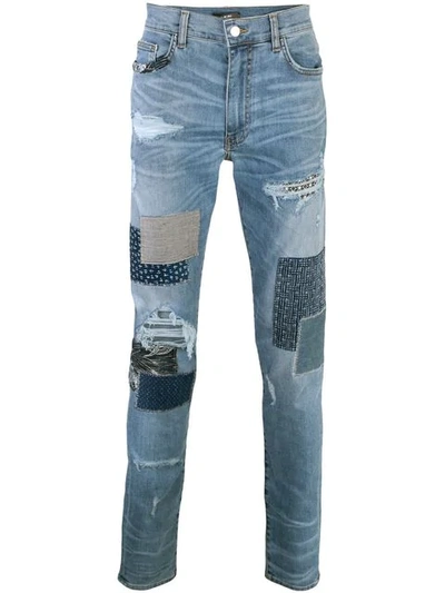 Amiri Distressed Patchwork Slim-leg Jeans In Blue