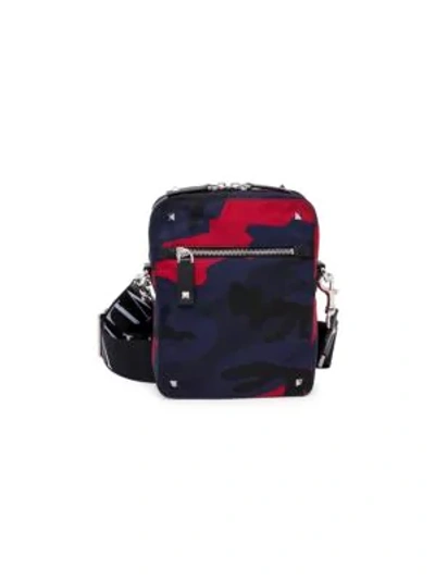 Valentino Garavani Uomo Camouflage Small Nylon Shoulder Bag With Vltn Ribbon Strap In Navy/ Red