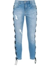 AMAPÔ LACE-UP SKINNY JEANS