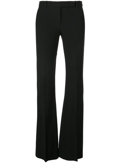 Alexander Mcqueen Tailored Wool Trousers Featuring Flared Hem In Black