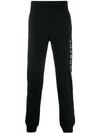 VERSACE PRINTED LOGO TRACK TROUSERS