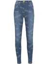 VERSACE ALL-OVER LOGO PRINT SKINNY JEANS