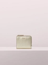 Kate Spade Sylvia Small Bifold Wallet In Pale Gold