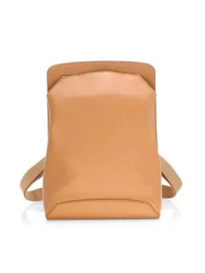 The Row Moulded Leather Backpack In Dark Salmon